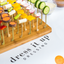 bamboo pick board featuring veggies skewered on toothpicks