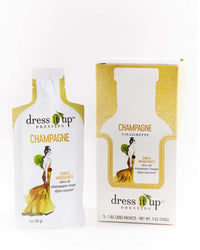 1 ounce packet of Champagne Vinaigrette by Dress It Up Dressing next to 5 pack box